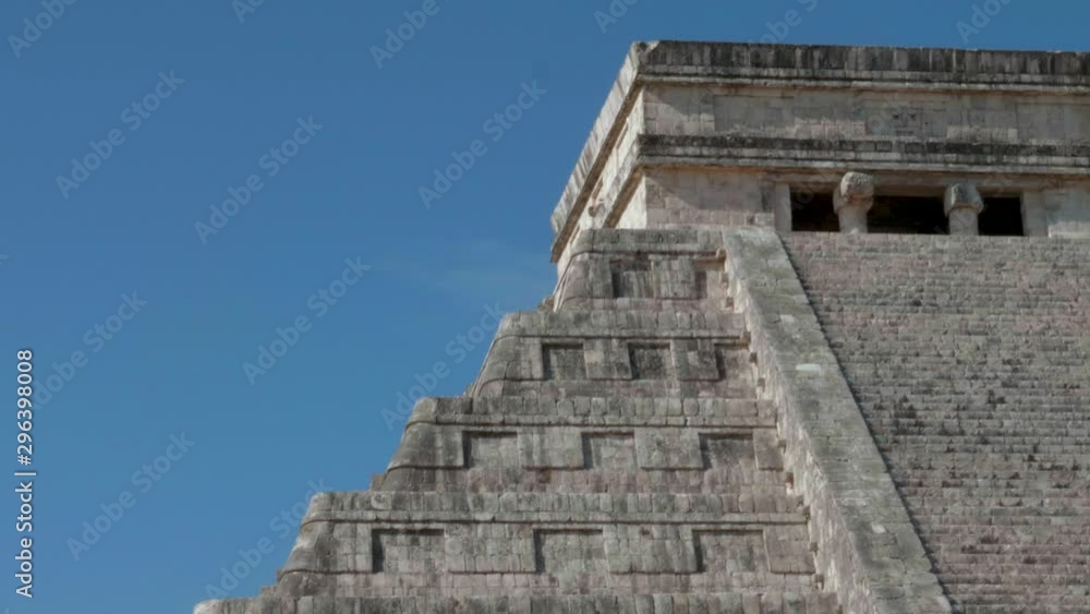 Ancient Aztec temple pyramids, historic Mexican building, tilt down