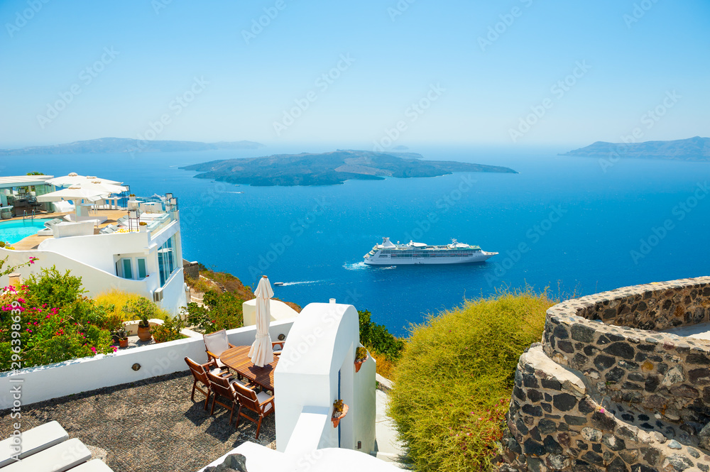 White architecture and blue sea on Santorini island, Greece. Summer holidays, travel destinations concept - obrazy, fototapety, plakaty 