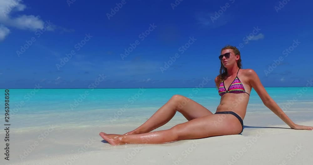 caucasian girl relaxing in shore of philippines sea, low angle shot caucasian girl relaxing in shore of philippines sea, low angle shot