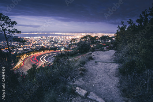 view at road to capetown at night from table mountain photo