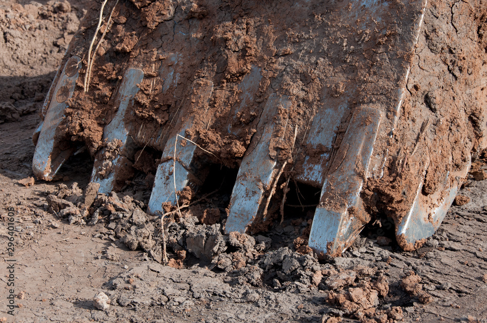 Naklejka premium Large crawler excavator bucket. Machines and mechanisms for construction.