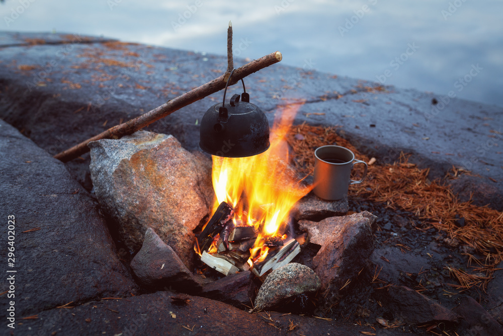 Coffee pot on campfire. Boil water in a camping kettle pot. Stock Photo |  Adobe Stock