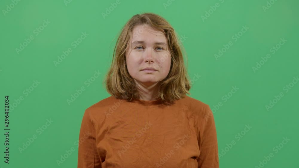 Woman Opening And Closing The Mouth Looking At The Camera. Studio Isolated Shot Against Green Screen Background Woman Opening And Closing The Mouth Looking At The Camera. Studio Isolated Shot Against Green Screen Background