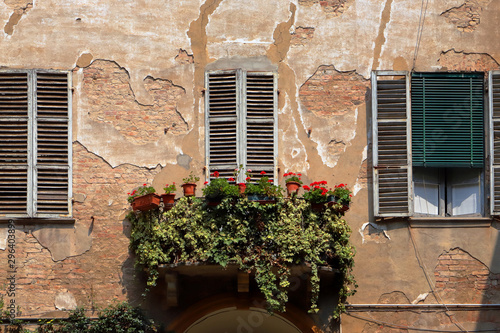 ancient windows and balcony with flowers