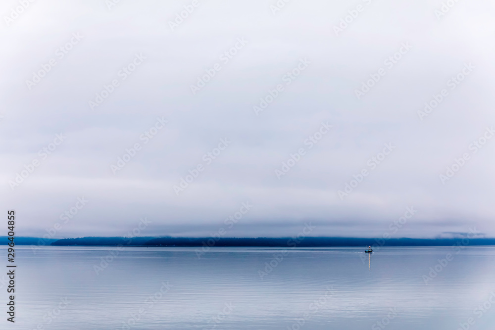 Boat on Ocean on Cloudy, Overcast Day