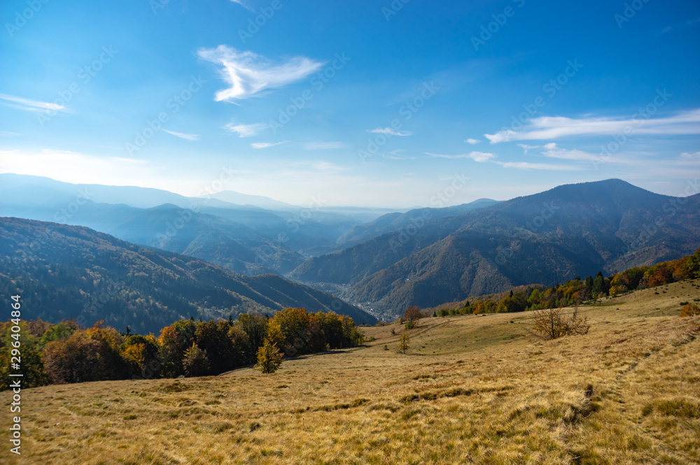 Fototapeta premium Mountains in a blue haze in autumn afternoon