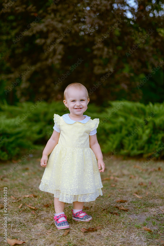 Smiling girl on the meadow looking right at camera. authentic image. Smiling girl on the meadow looking right at camera. authentic image.