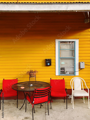 Outdoor furniture against yellow wooden background