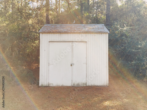Portrait view of a metal shack in the woods