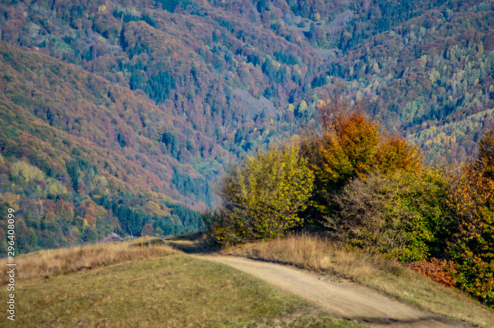 Dirt road in the mountains in autumn
