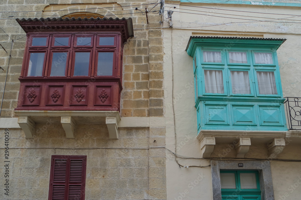 Facade of the old traditional wooden Maltese balony, Nadur, Gozo, Malta