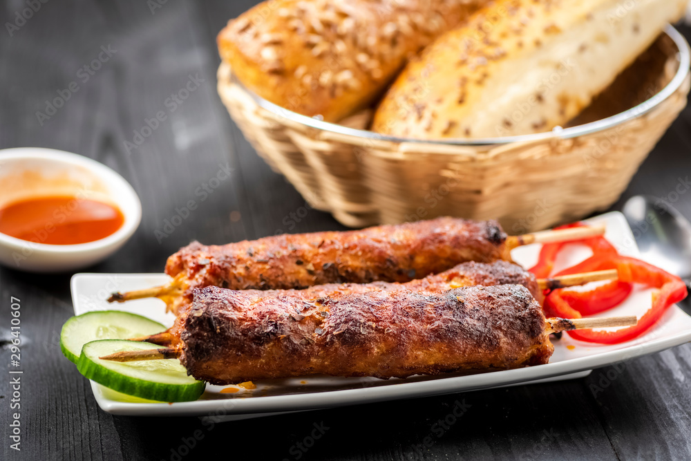 kebab on sticks served with vegetables