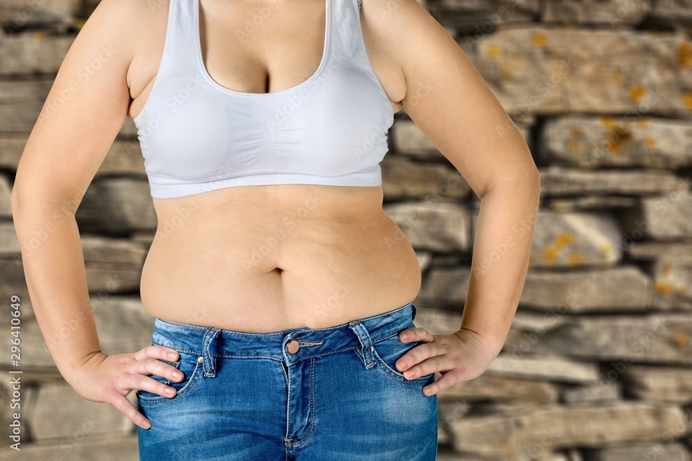 Woman with fat belly on background. Woman with fat belly on background.