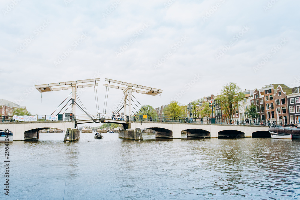 Amsterdam, Netherlands September 5, 2017: Magere Brug Bridge and Amstel river.