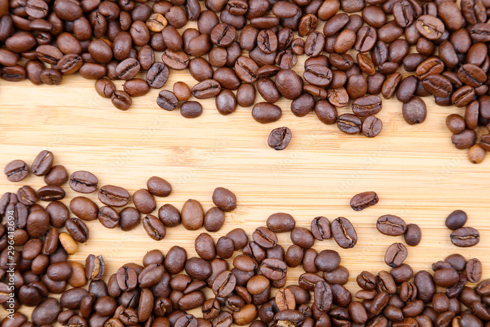 Fototapeta premium Coffee beans on wood