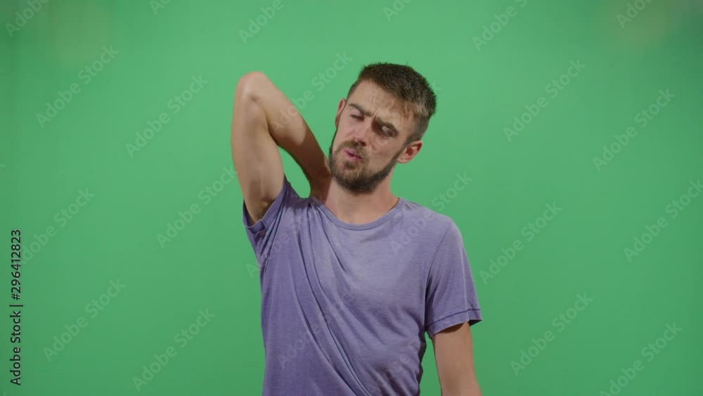 Adult Man Scratching His Back. Studio Isolated Shot Against Green Screen Background Adult Man Scratching His Back. Studio Isolated Shot Against Green Screen Background