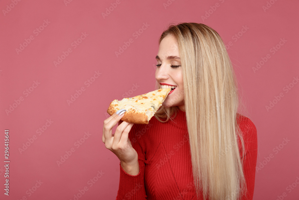 Happy girl with delicious pizza isolated over the pink background Happy girl with delicious pizza isolated over the pink background