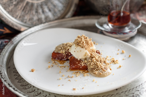 Fototapeta Naklejka Na Ścianę i Meble -  Turkish Pumpkin Dessert with Tahini, Ice Cream and Walnut, Tahinli Kabak Tatlisi.