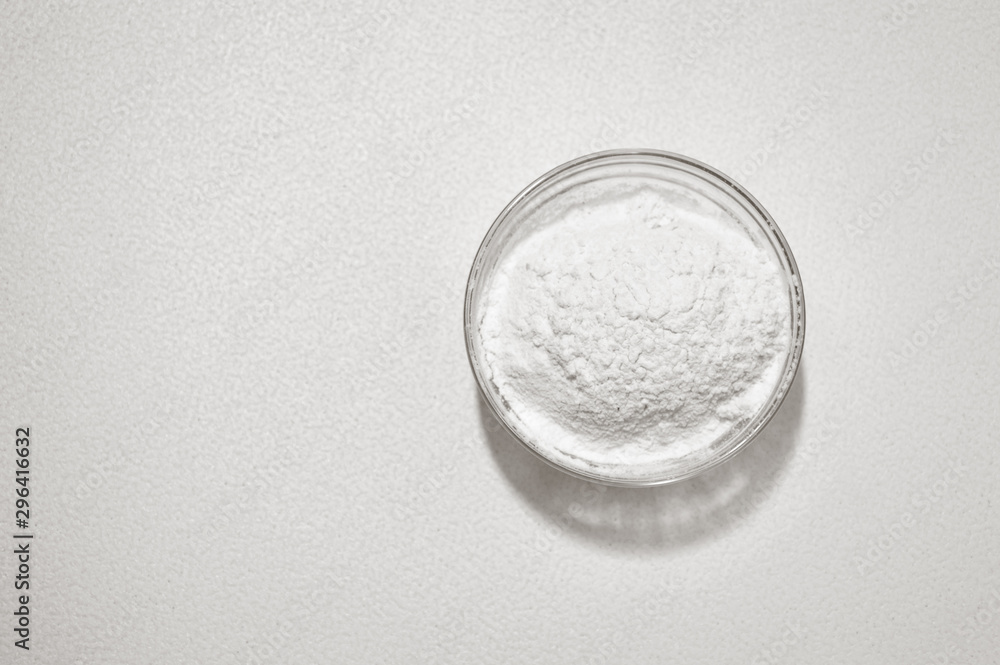 wheat flour in a glass bowls on a white background wheat flour in a glass bowls on a white background