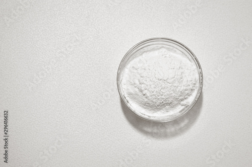 wheat flour in a glass bowls on a white background