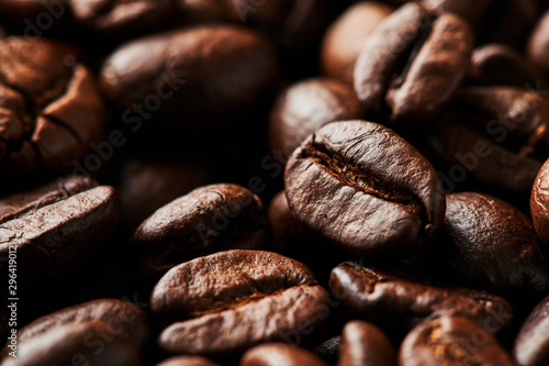 Close up of roasted coffee beans for background, texture and design. Selective focus.