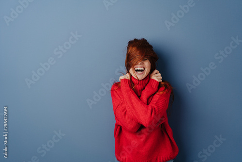 Картината върху платно Laughing mischievous young redhead woman