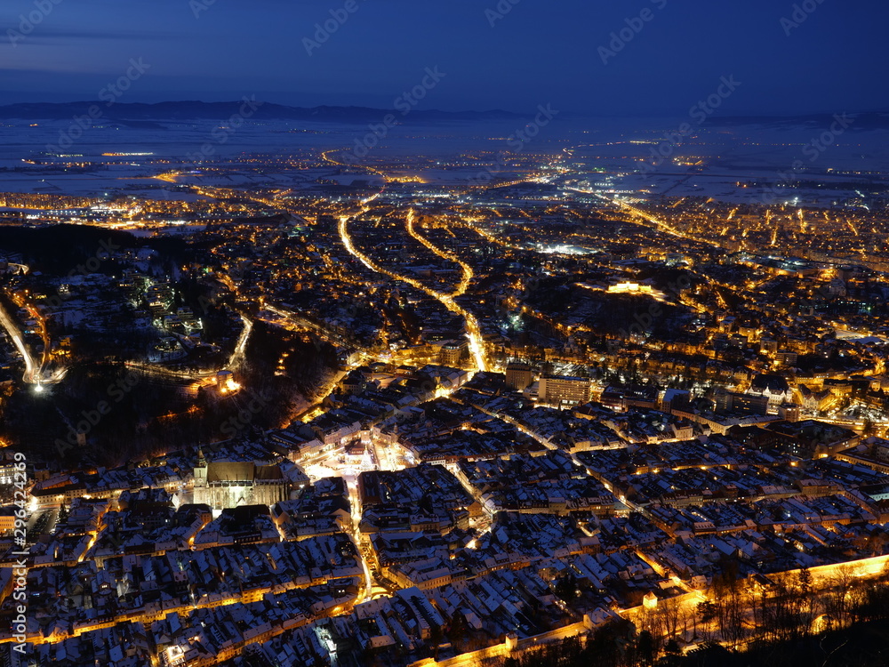 Aerial top view night panorama of city streets lights