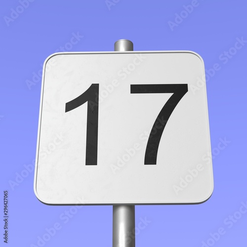 Number 17. Seventeen. Street sign on blue clear sky background