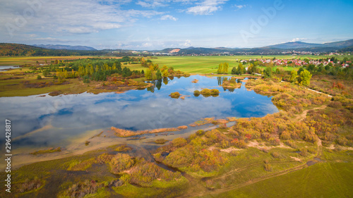 Aerial drone view of amazing autumn colors on the lake. Cerknisko lake, Slovenia