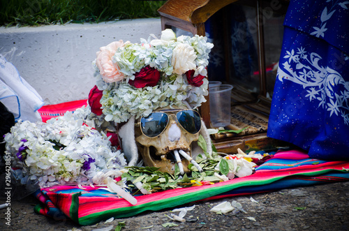 The photograph shows a human skull at a Bolivian party where death is venerated photo