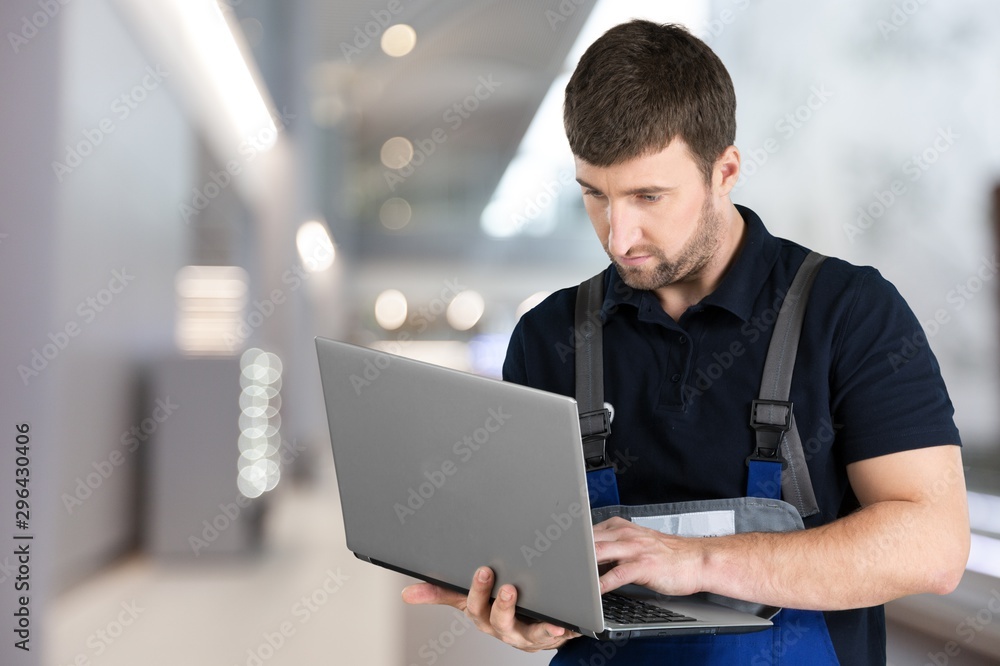 Delivery man with clipboard on office background Delivery man with clipboard on office background