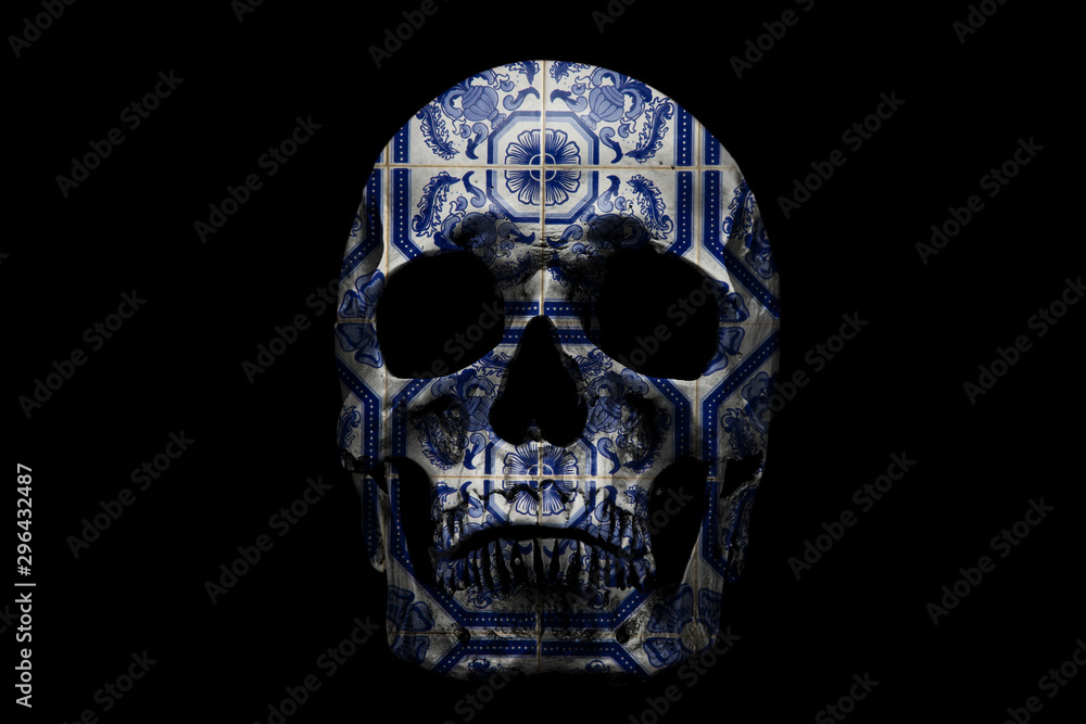 Human skull with ornate pattern on black background. Traditional Portuguese, glazed ceramic tiles. Human skull with ornate pattern on black background. Traditional Portuguese, glazed ceramic tiles.