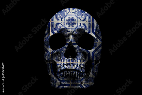 Human skull with ornate pattern on black background. Traditional Portuguese  glazed ceramic tiles.