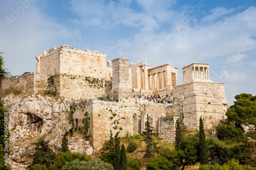 Tourists visiting the Acropolis in a beautiful early spring day seen from the Areopagus Hill in Athens