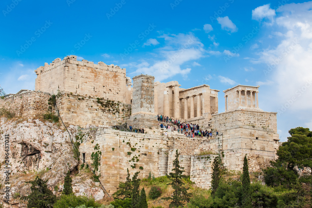 Tourists visiting the Acropolis in a beautiful early spring day seen from the Areopagus Hill in Athens