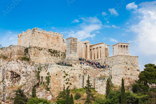 Tourists visiting the Acropolis in a beautiful early spring day seen from the Areopagus Hill in Athens © anamejia18