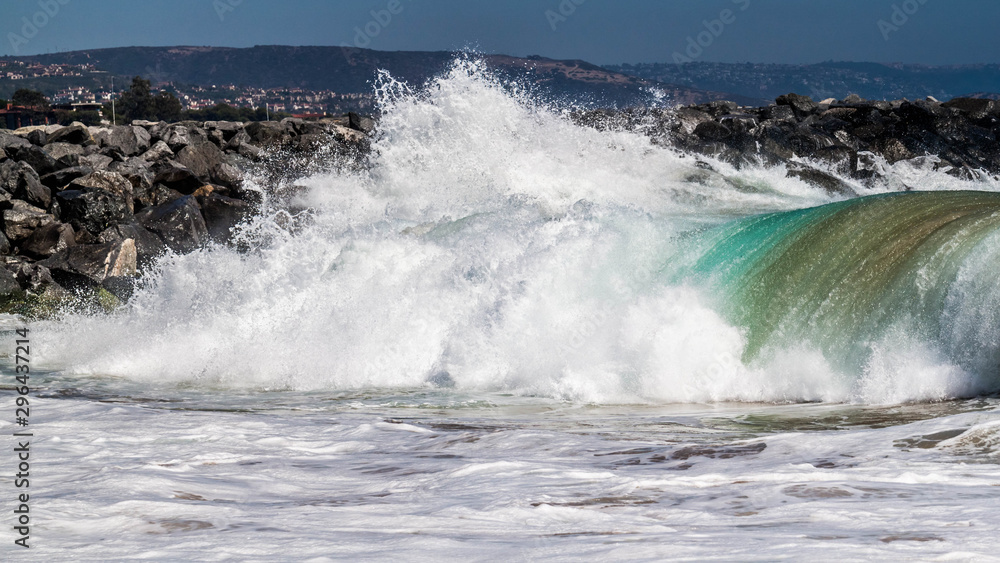 Big wave rolling towards the shore on Balboa Peninsula, CA.