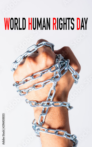 Chained fist hands with WORLD HUMAN RIGHTS DAY text