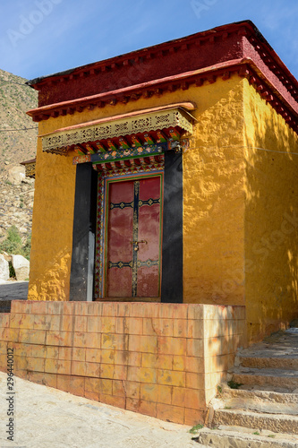 A bright yellow building adds color at Drepung Monastery in Lhasa, Tibet. © Kim