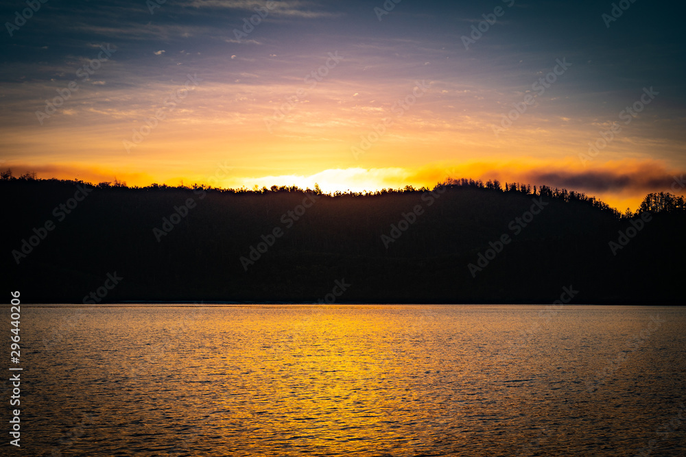 Obraz premium sunrise behind island