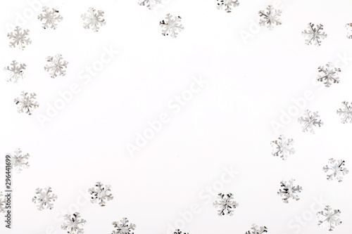 Christmas modern composition. Xmas decorations  silver snowflakes on white background. Christmas  New Year  winter concept. Flat lay  top view  copy space
