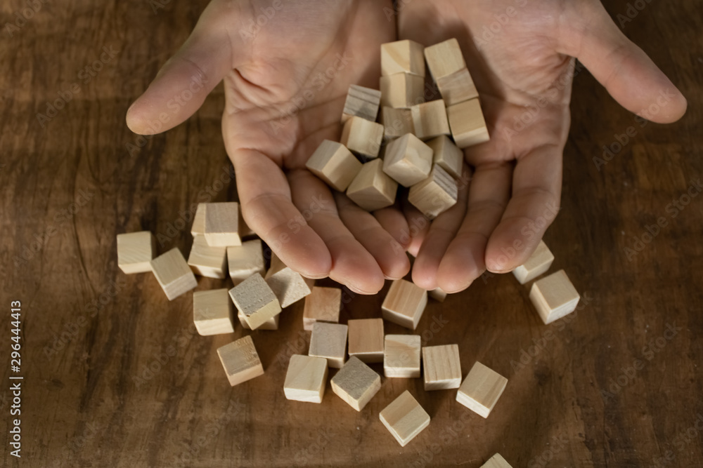 Wooden small blocks on the background. Background for desktop. Office style.Agile and scrum. Team players.Social life.In the office.Equality and diversity Wooden small blocks on the background. Background for desktop. Office style.Agile and scrum. Team players.Social life.In the office.Equality and diversity