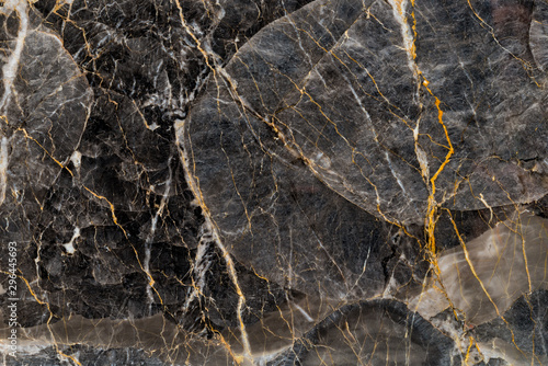 Black and gold marble texture stone background.