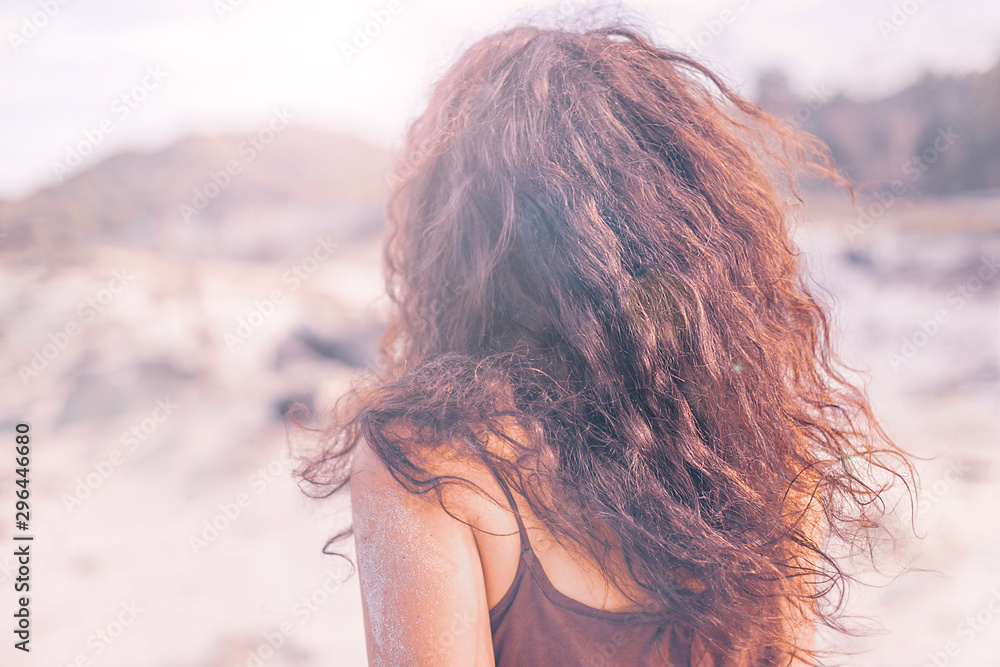 close up portrait of young woman from the back outdoors at sunset close up portrait of young woman from the back outdoors at sunset