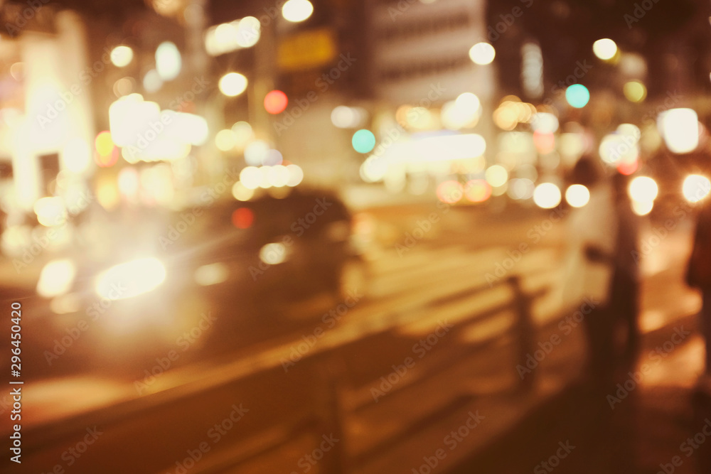 People walking at footpath in night time with light bokeh.Crowded street in Japan, blurred background in japan .for background usage. People walking at footpath in night time with light bokeh.Crowded street in Japan, blurred background in japan .for background usage.