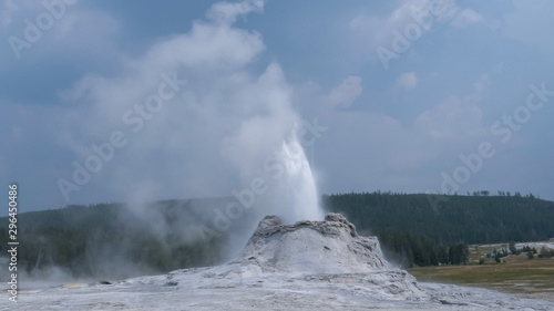 wide shot of castle geyser in yellowstone