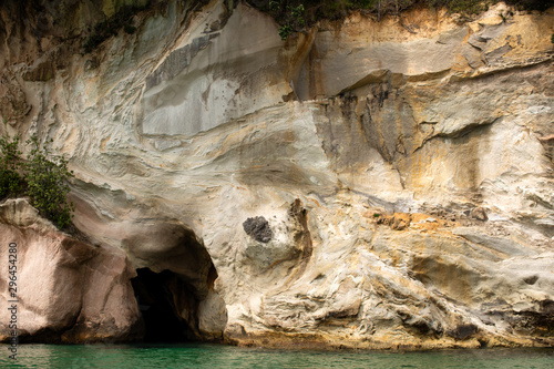 Cliffs and rock formations along the coastline of Cathedral Cove photo