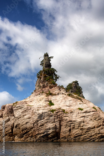 Cliffs and rock formations along the coastline of the Coromandel Peninsula photo