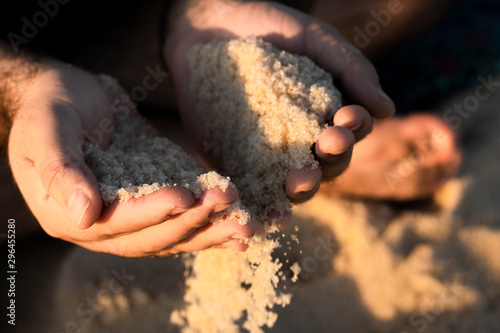 Hands with sand