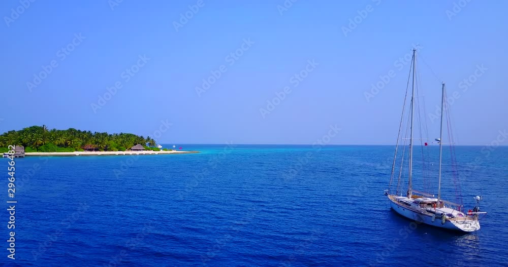 Aerial video over tropical island beach, Maldives. Palm trees and white sand beach. Drone shot. Aerial video over tropical island beach, Maldives. Palm trees and white sand beach. Drone shot.